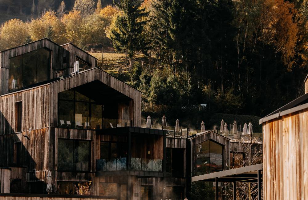 Outdoor area with pool at the Naturhotel Forsthofgut in Leogang