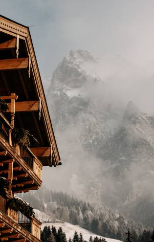 Fog rises from the mountain in winter