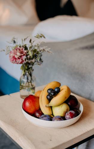 Fresh fruit bowl with flowers