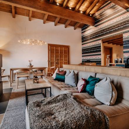 Spacious living area with fireplace in the chalet suite