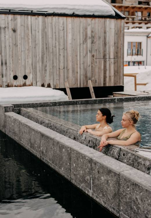 Two women in winter in the 42 degree hot onsen pool