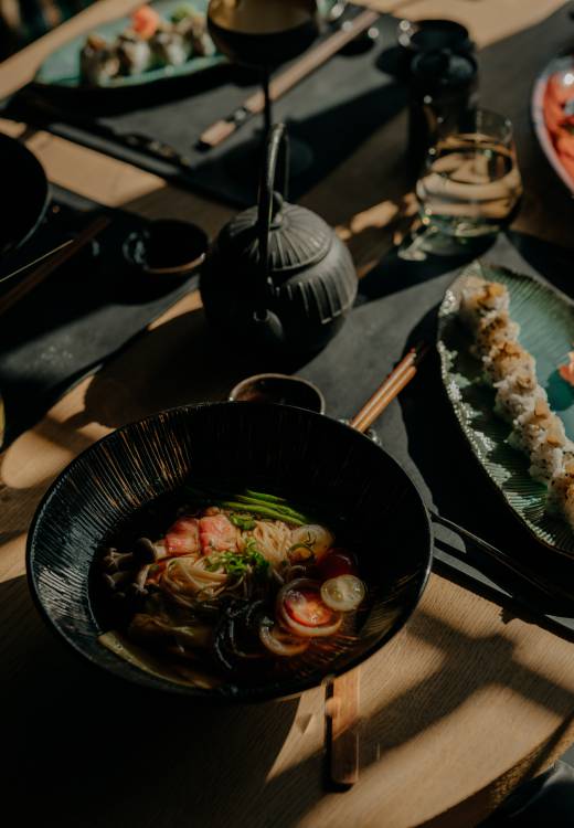 Japanese restaurant mizumi with a set table and dishes like ramen