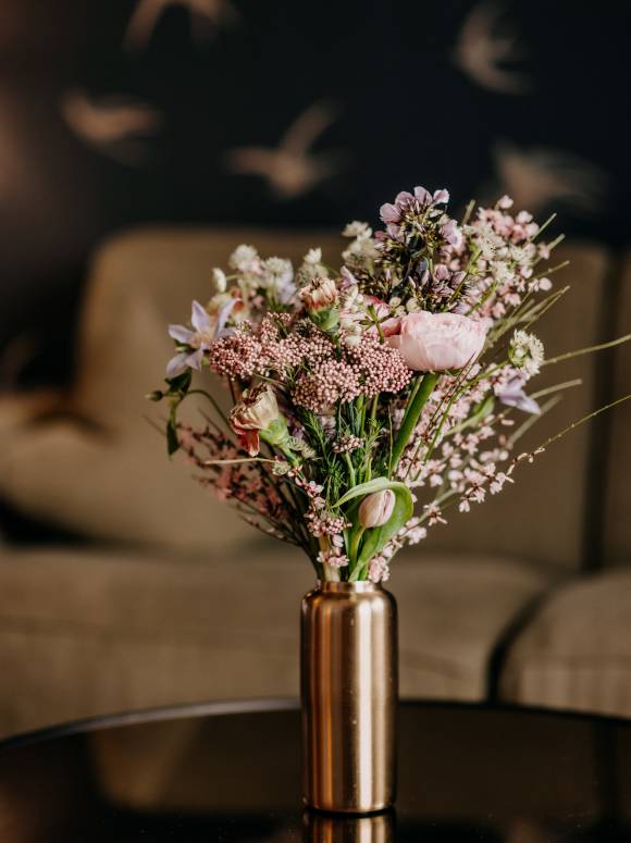 Bouquet of flowers in rose gold vase