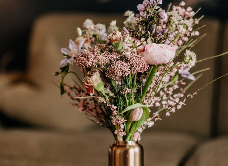 Bouquet of flowers in rose gold vase